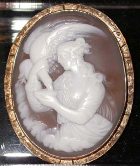 an%20antique%20cameo%20brooch%20with%20a%20gold%20oval%20frame%20depicting%20%22Leda%20and%20the%20Swan%22%20in%20high%20relief%20dating%20from%20mid%2019th%20century